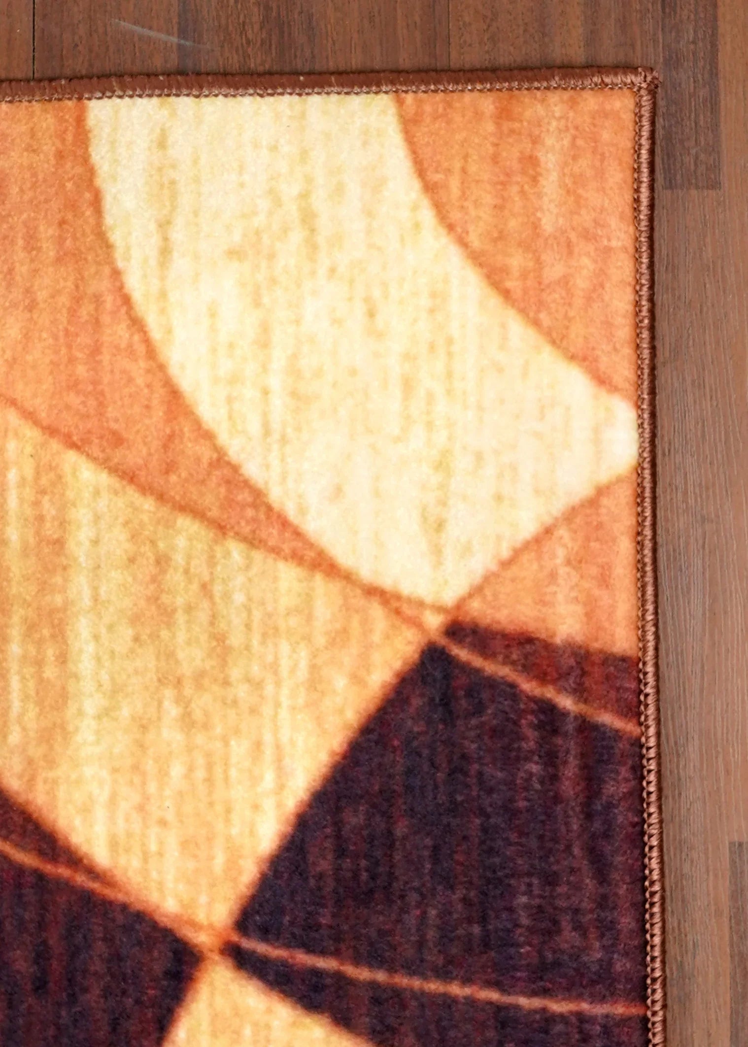 Geometric patterned rug on a wooden floor