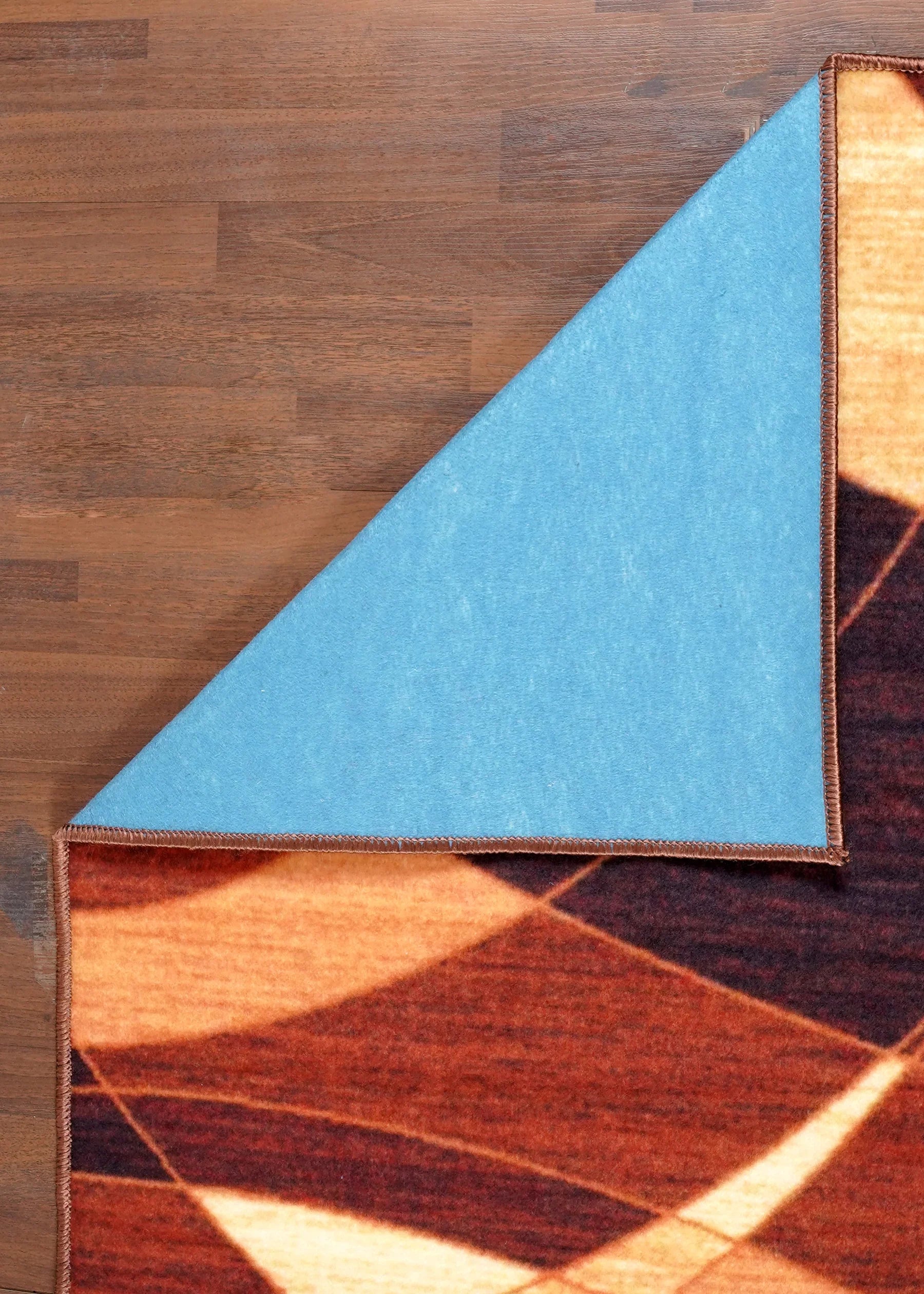 Geometric patterned rug on a wooden floor