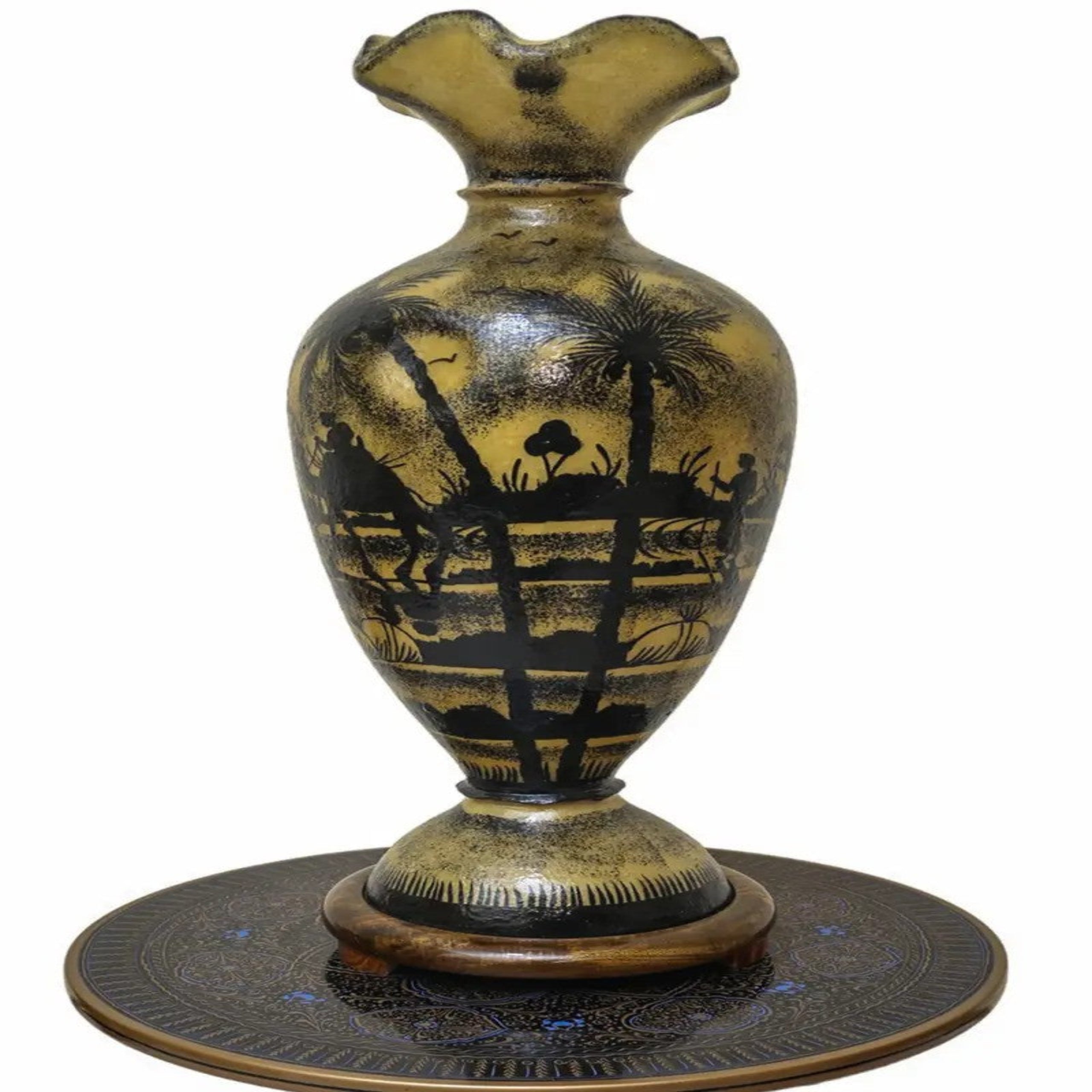 Decorative vase with black silhouette design on a white background