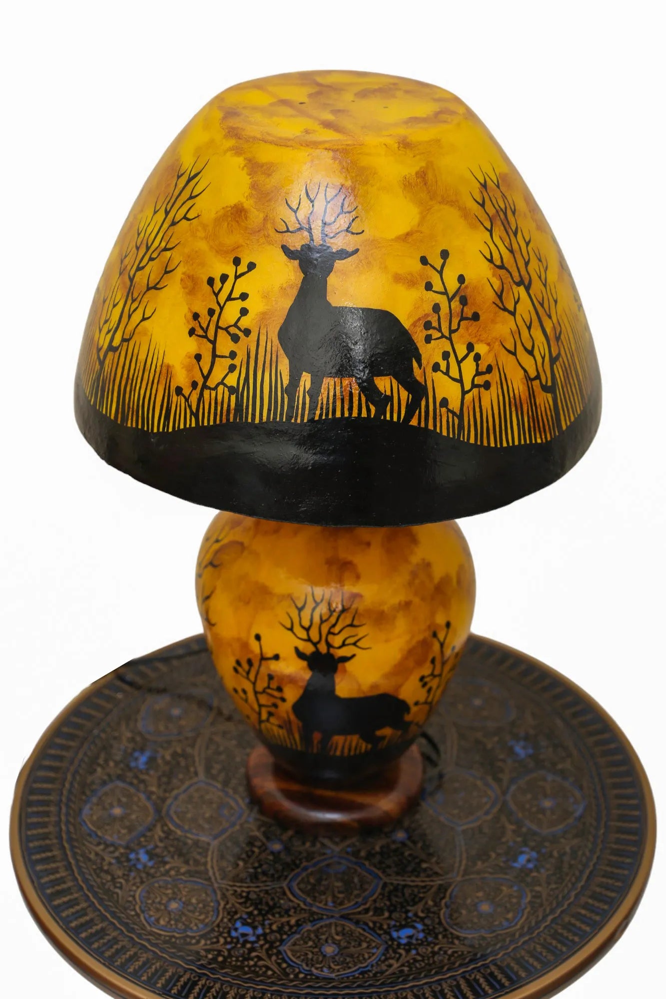 “Handpainted fluorescent camel skin lamp with wooden base – artisan-crafted decorative lamp with warm glow”