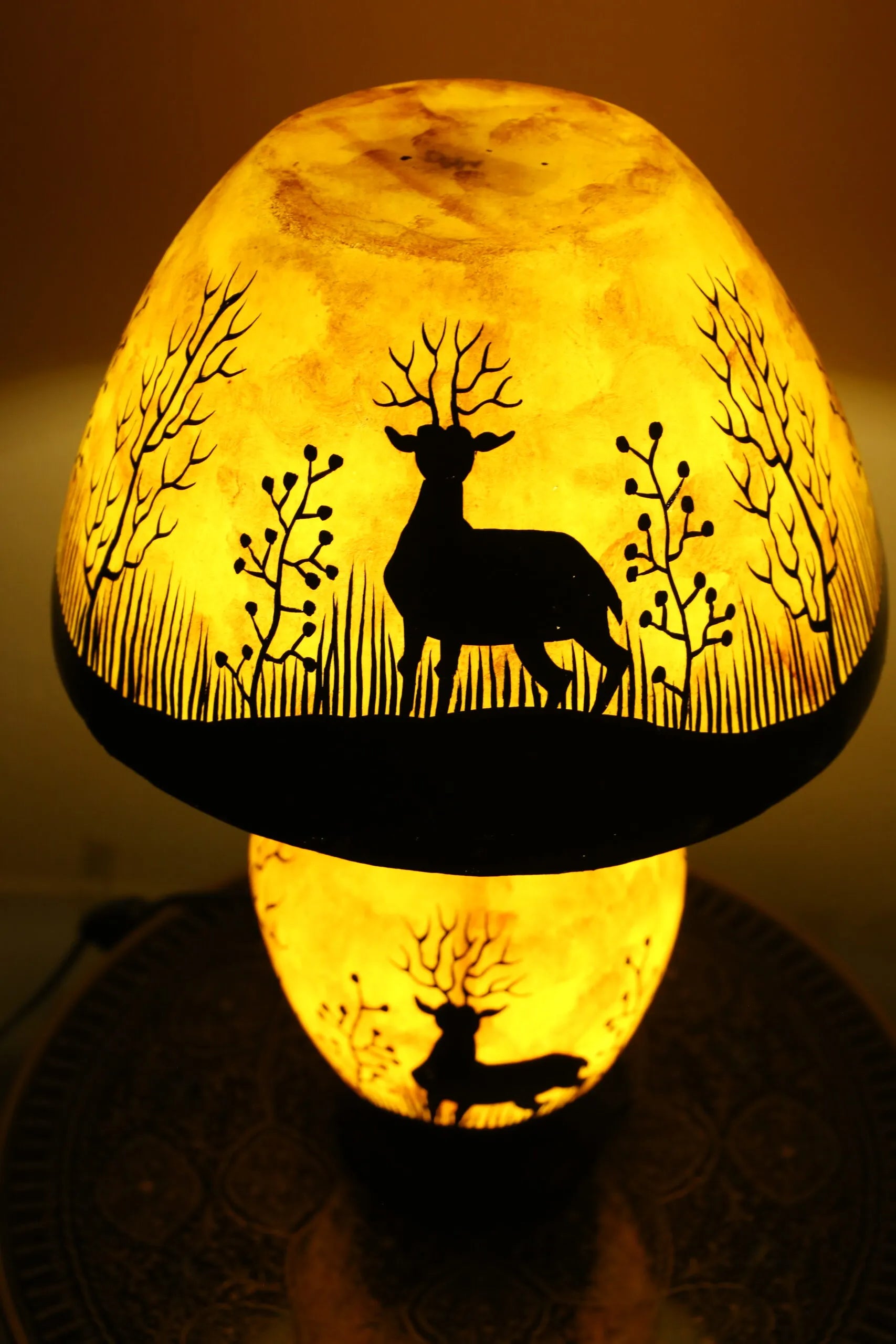 “Handpainted fluorescent camel skin lamp with wooden base – artisan-crafted decorative lamp with warm glow”