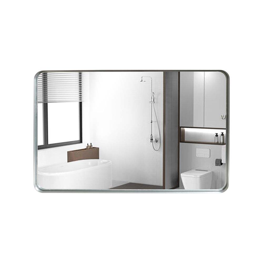 Bathroom mirror reflecting a modern bathroom with sink, toilet, and shower.