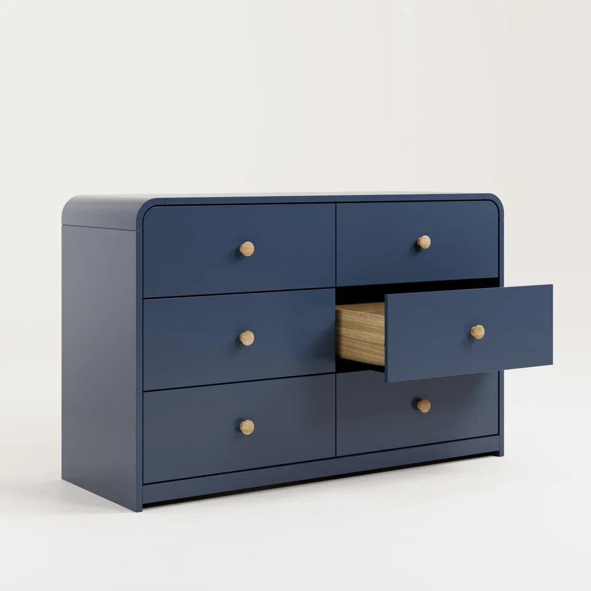 A navy blue 6-drawer dresser with light wood knobs, featuring one open drawer showing a light wood interior, set against a plain off-white background Midnight Blue