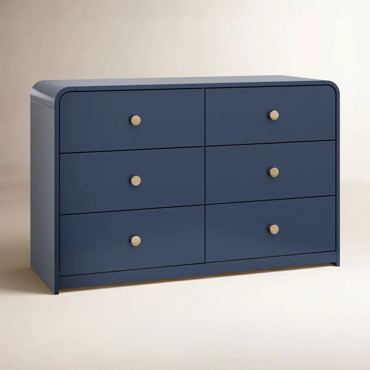 A navy blue 6-drawer dresser with light wood knobs, featuring one open drawer showing a light wood interior, set against a plain off-white background Midnight Blue