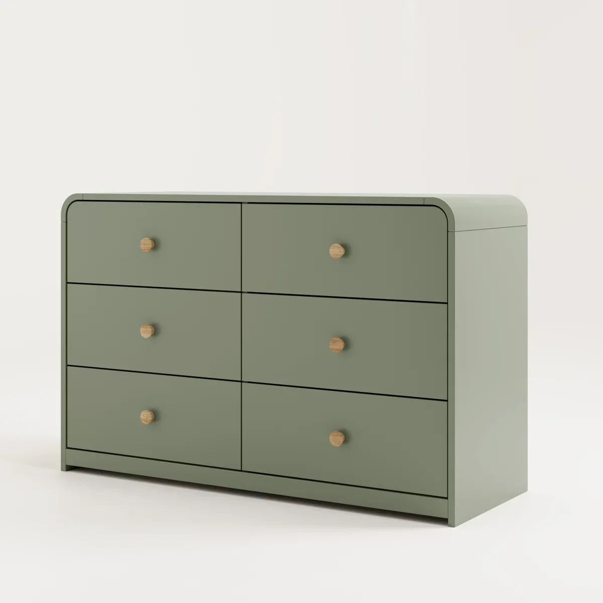 A modern six-drawer dresser in a muted sage green with small round light wood knobs, shown against a neutral beige background.