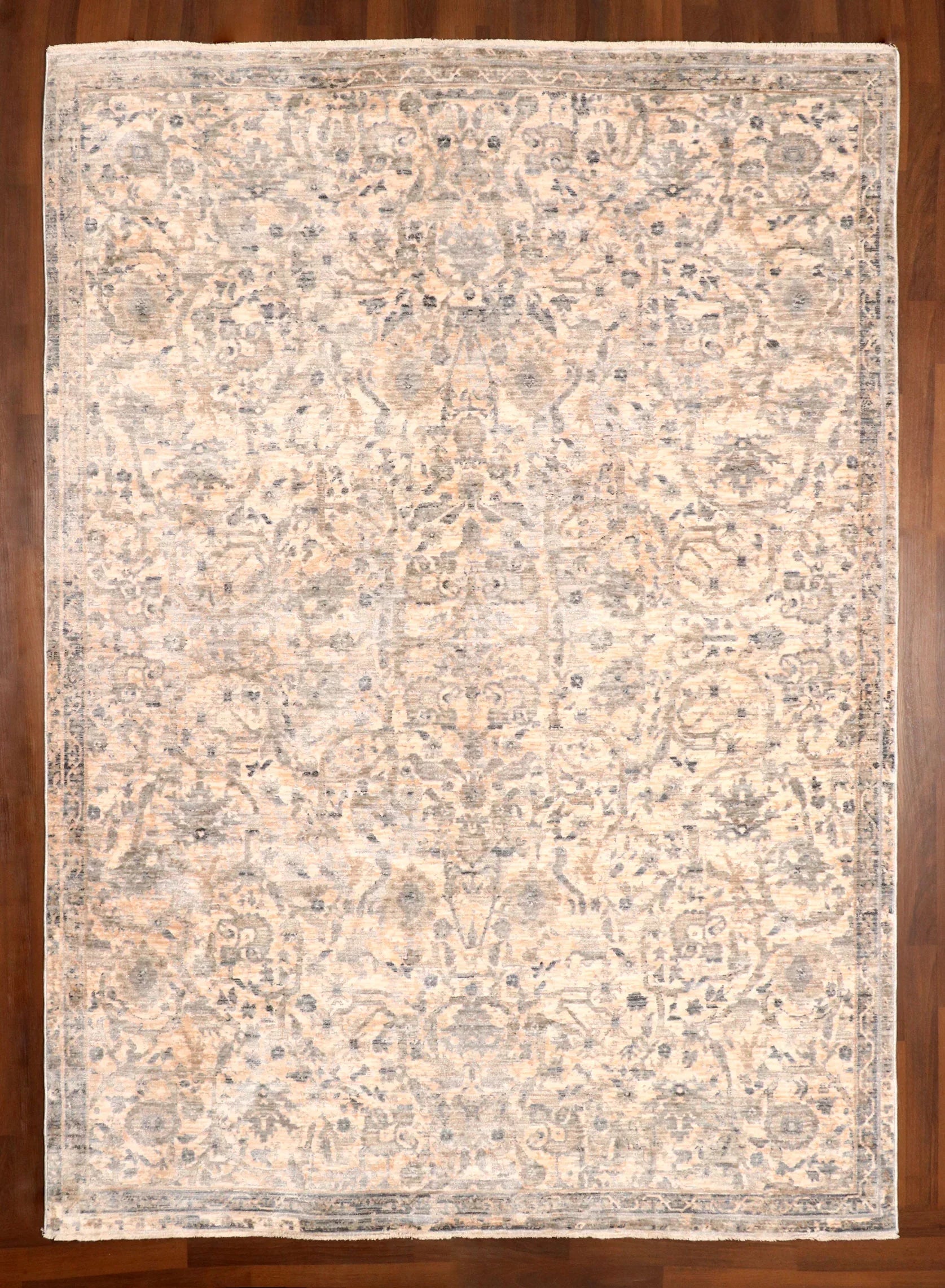 Patterned rug on a wooden floor