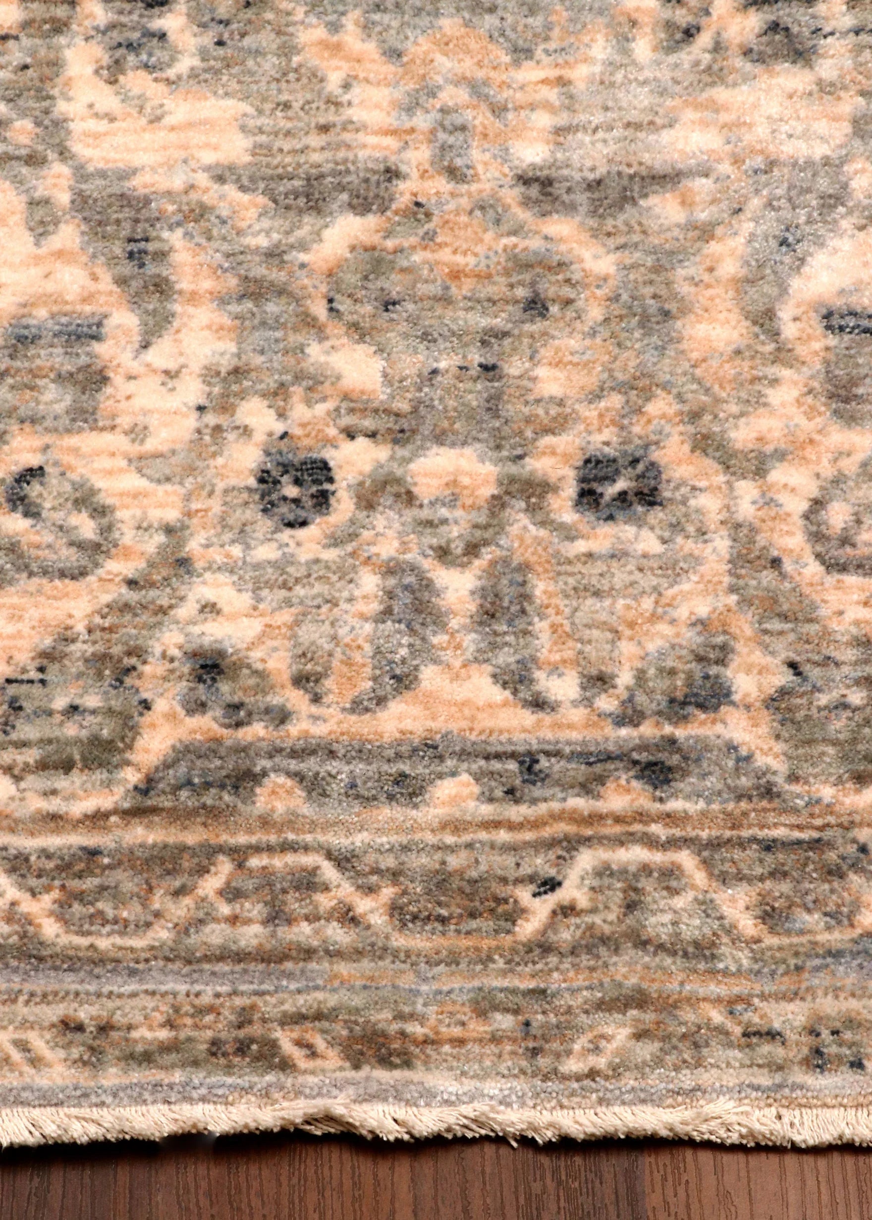 Patterned rug on a wooden floor