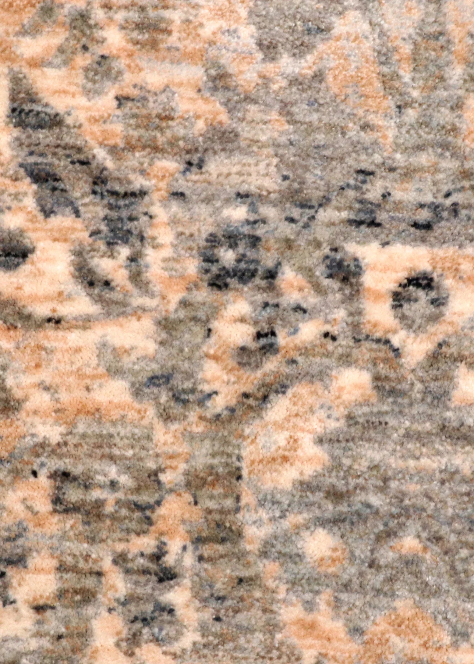 Patterned rug on a wooden floor