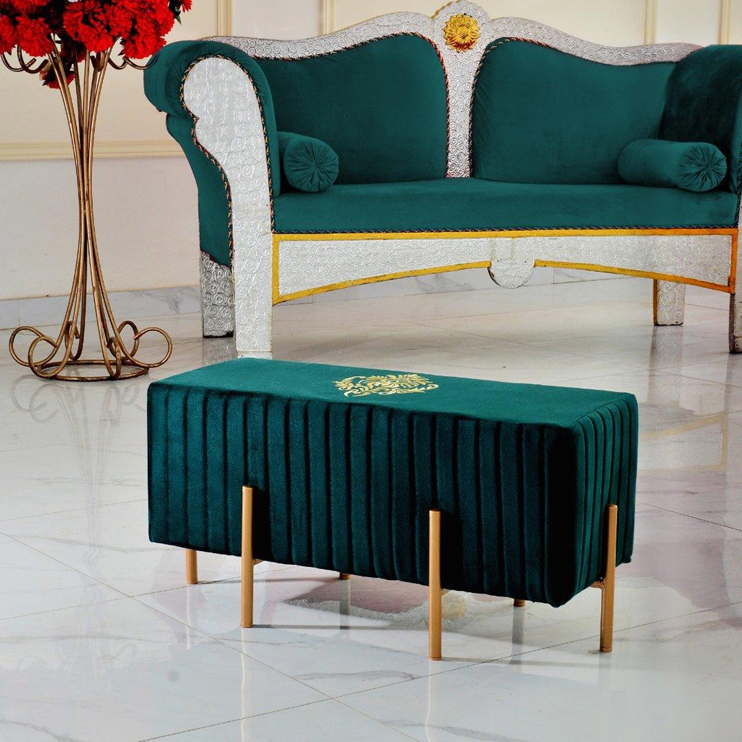 Green table cover with gold emblem on a marble floor