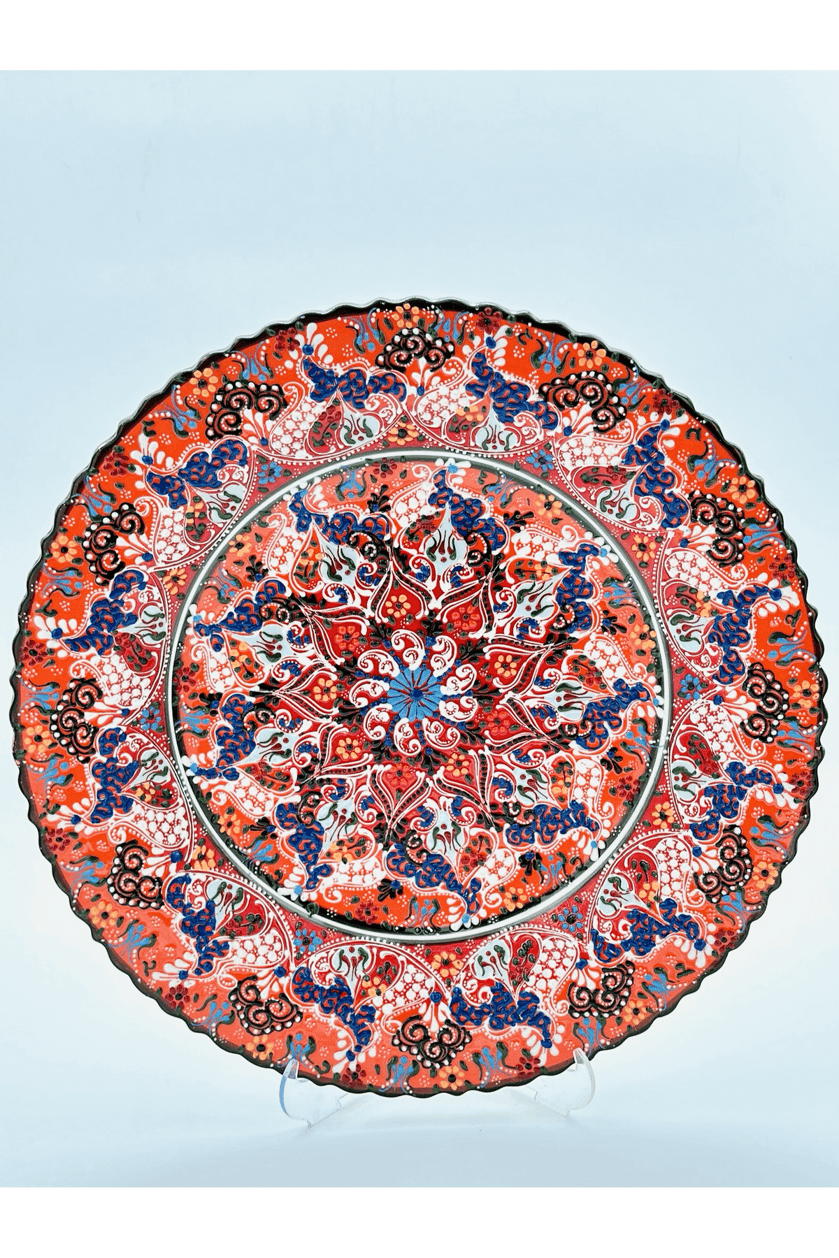 Decorative plate with intricate floral pattern on a light blue background