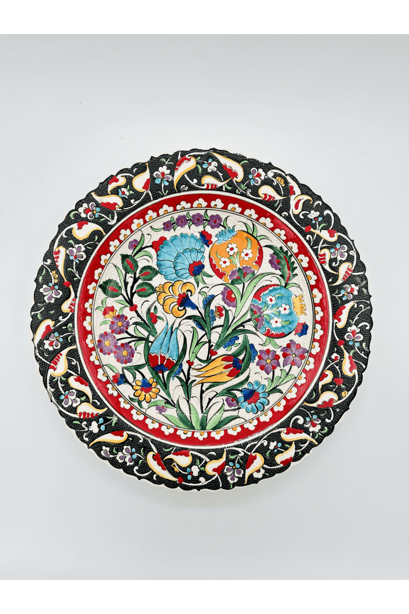 Decorative plate with floral and bird patterns on a white background