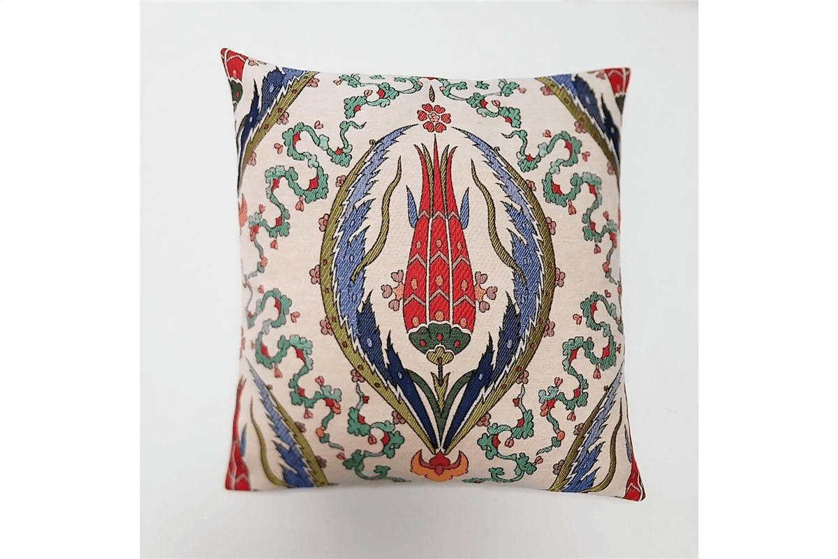 Decorative pillow with intricate floral pattern on a plain background