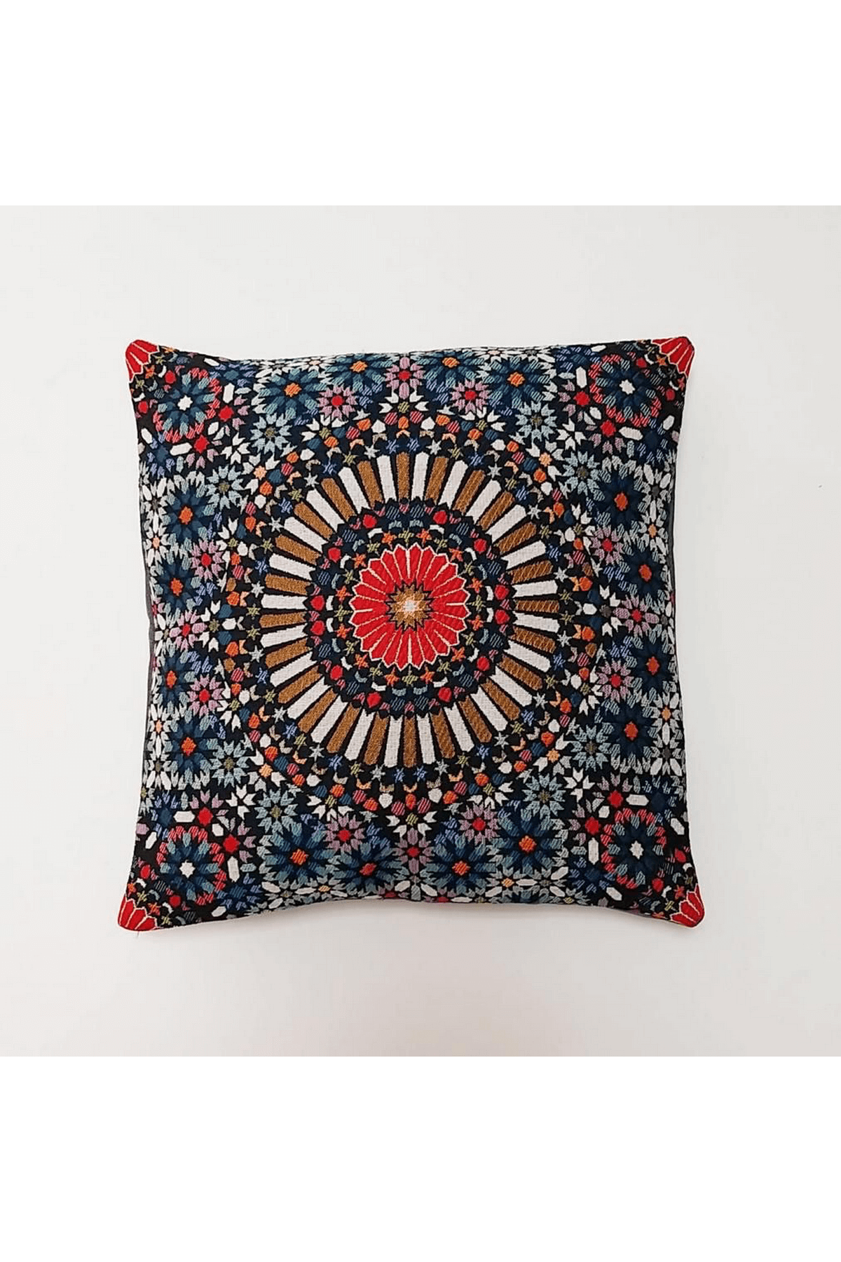Decorative pillow with a colorful mandala pattern on a white background