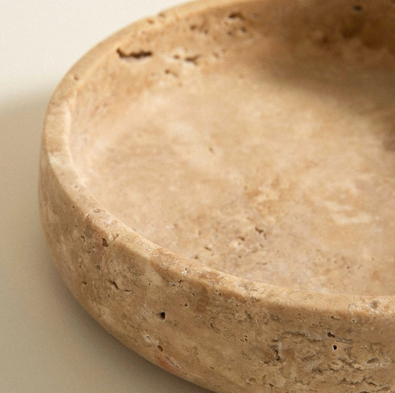 Beige ceramic bowl on a beige background