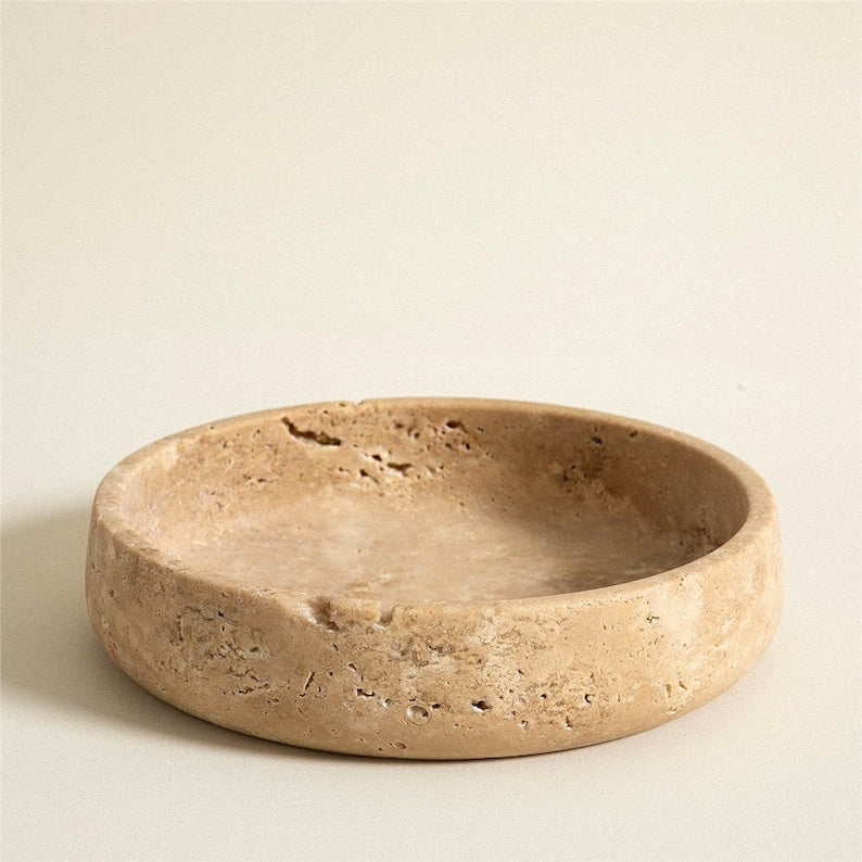 Beige ceramic bowl on a beige background