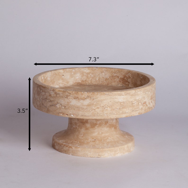 Beige stone bowl with dimensions on a light gray background