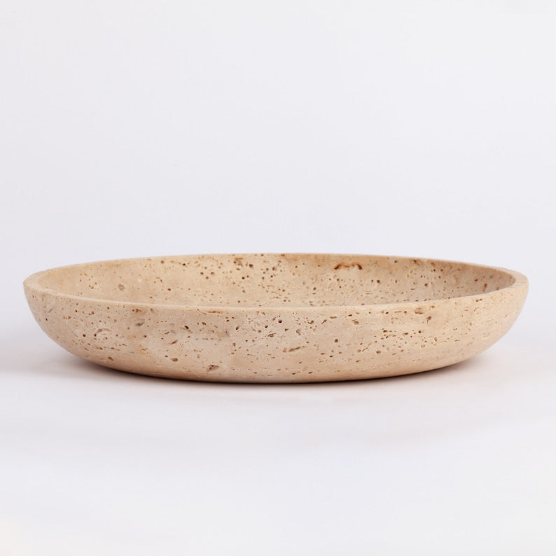 Beige ceramic plate on a white background