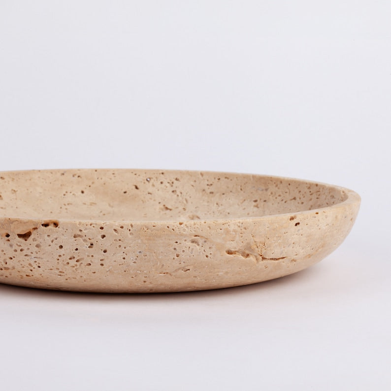 Beige ceramic plate on a white background