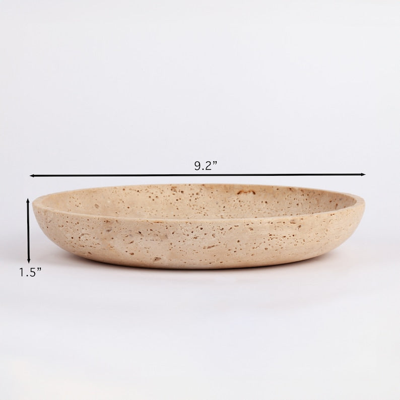 Beige ceramic plate on a white background