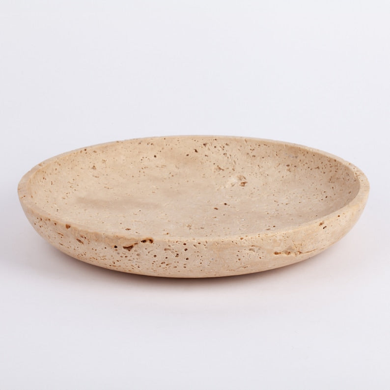 Beige ceramic plate on a white background