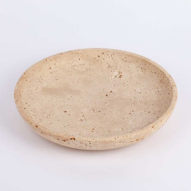 Beige ceramic plate on a white background