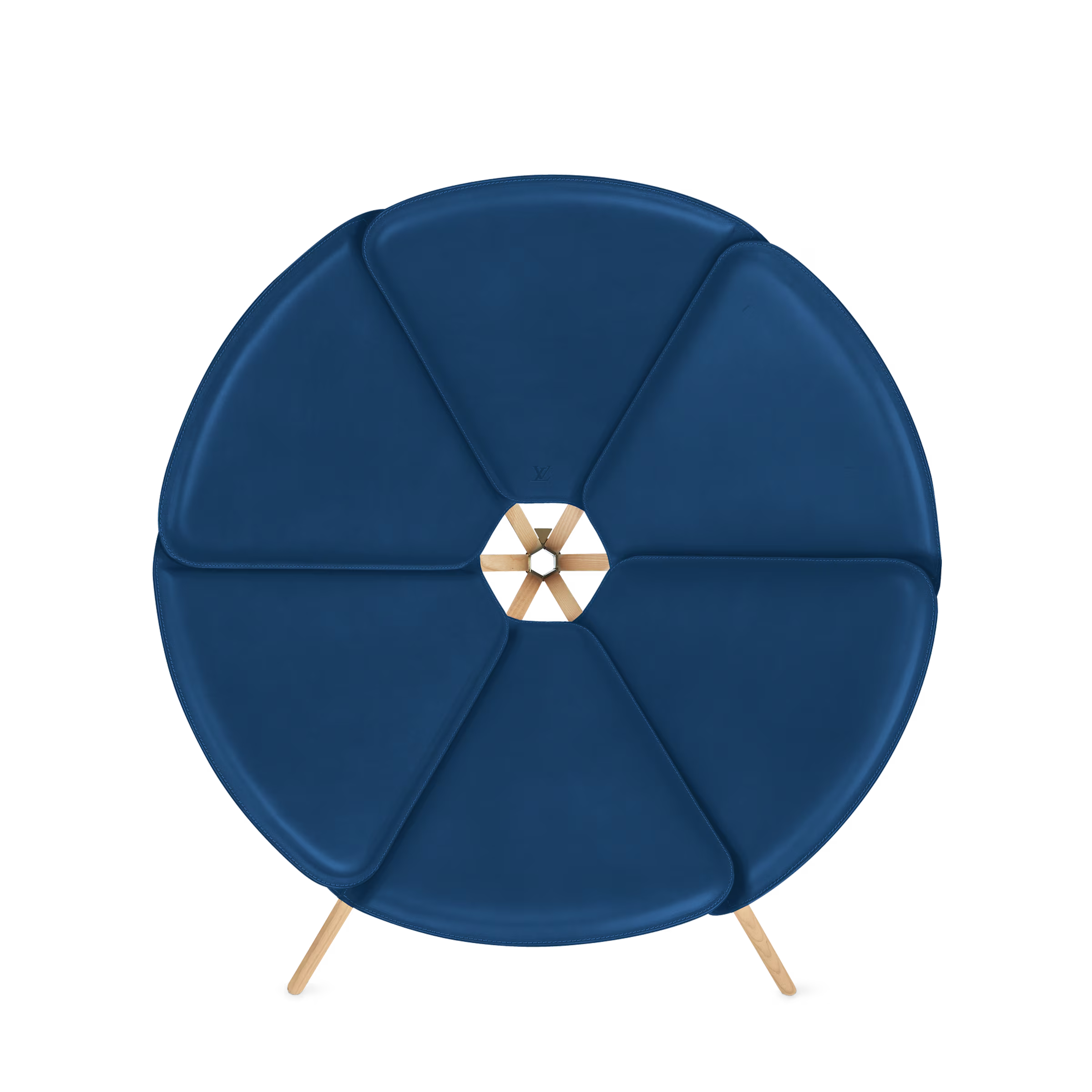 Blue round ottoman with a decorative center piece on a white background