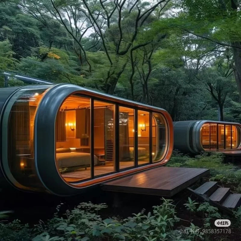 Modern capsule-style treehouse pods with large glass windows and warm interior lighting, set among dense green forest trees and plants.
