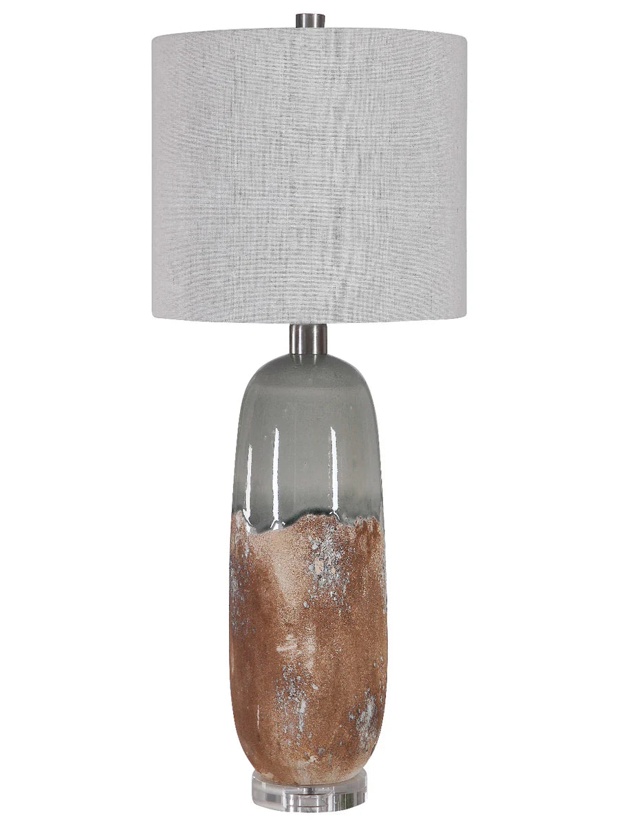 Table lamp with a textured gray shade and a base with natural wood finish on a white background